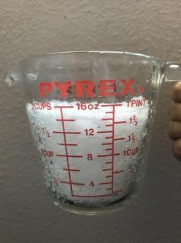 Image of snow in a measuring cup